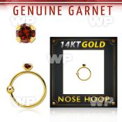 ghge2 14kt gold nose hoop w a 2mm prong set garnet stone